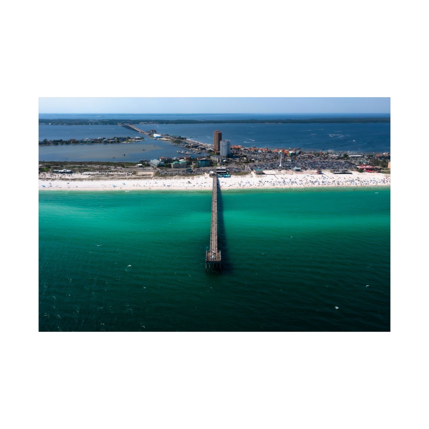 Pensacola Beach Pier Engulfed in its Iconic Emerald Waters.