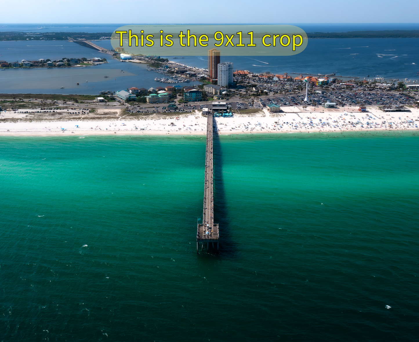 Pensacola Beach Pier Engulfed in its Iconic Emerald Waters.